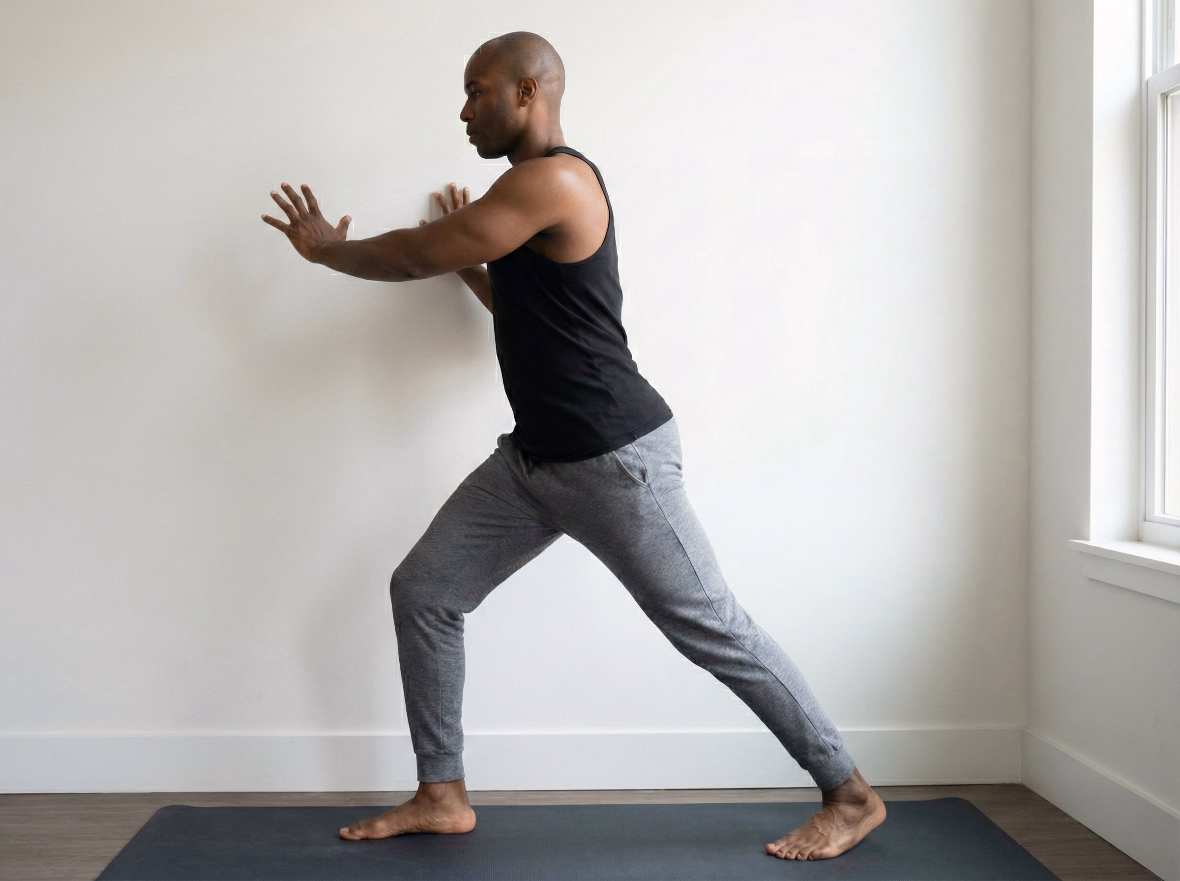 Step 1 – Staggered stance setup facing wall