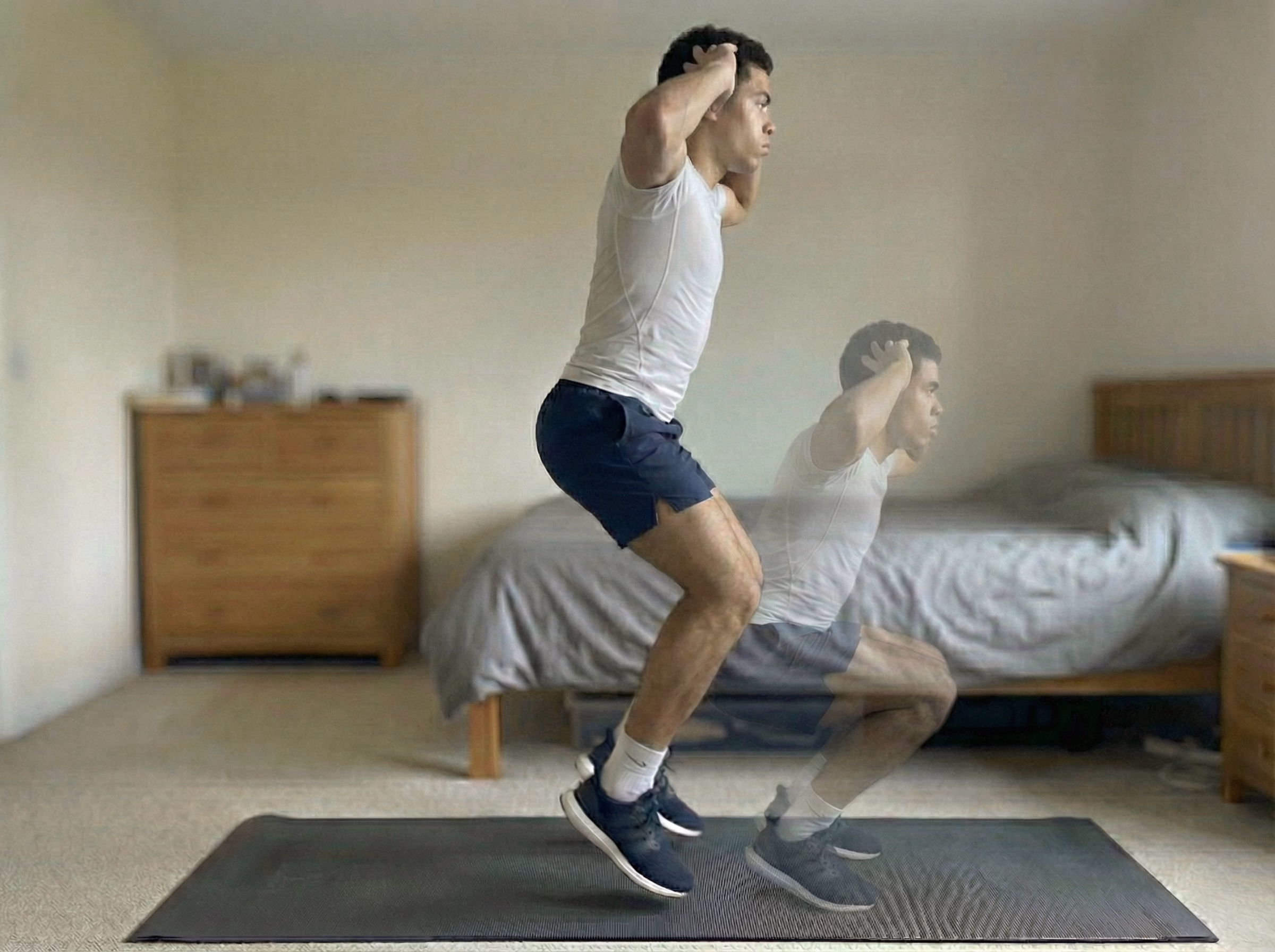 Teen landing in a soft squat with blue glow through legs and spine