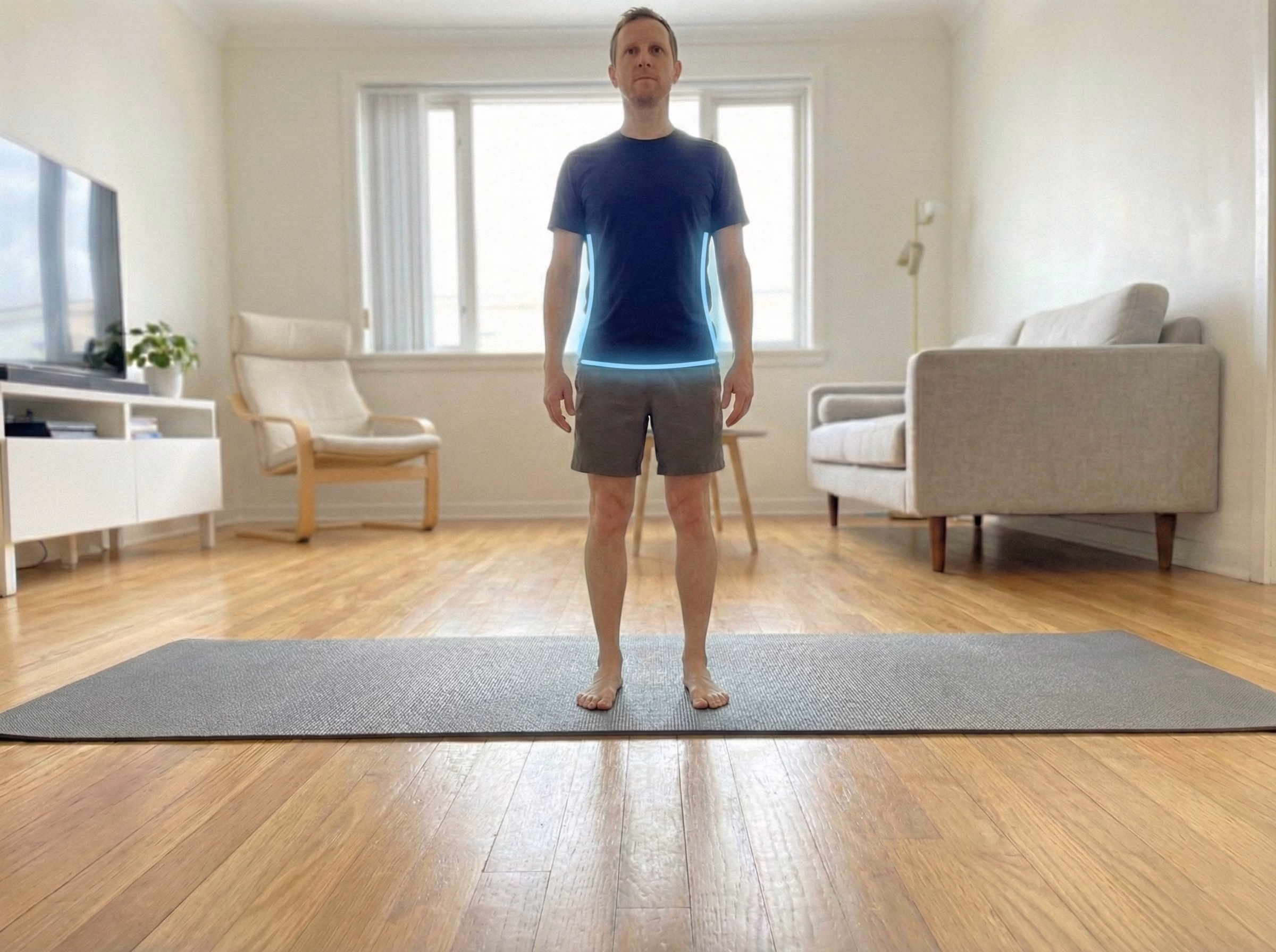 Standing straight from front with level hips and shoulders