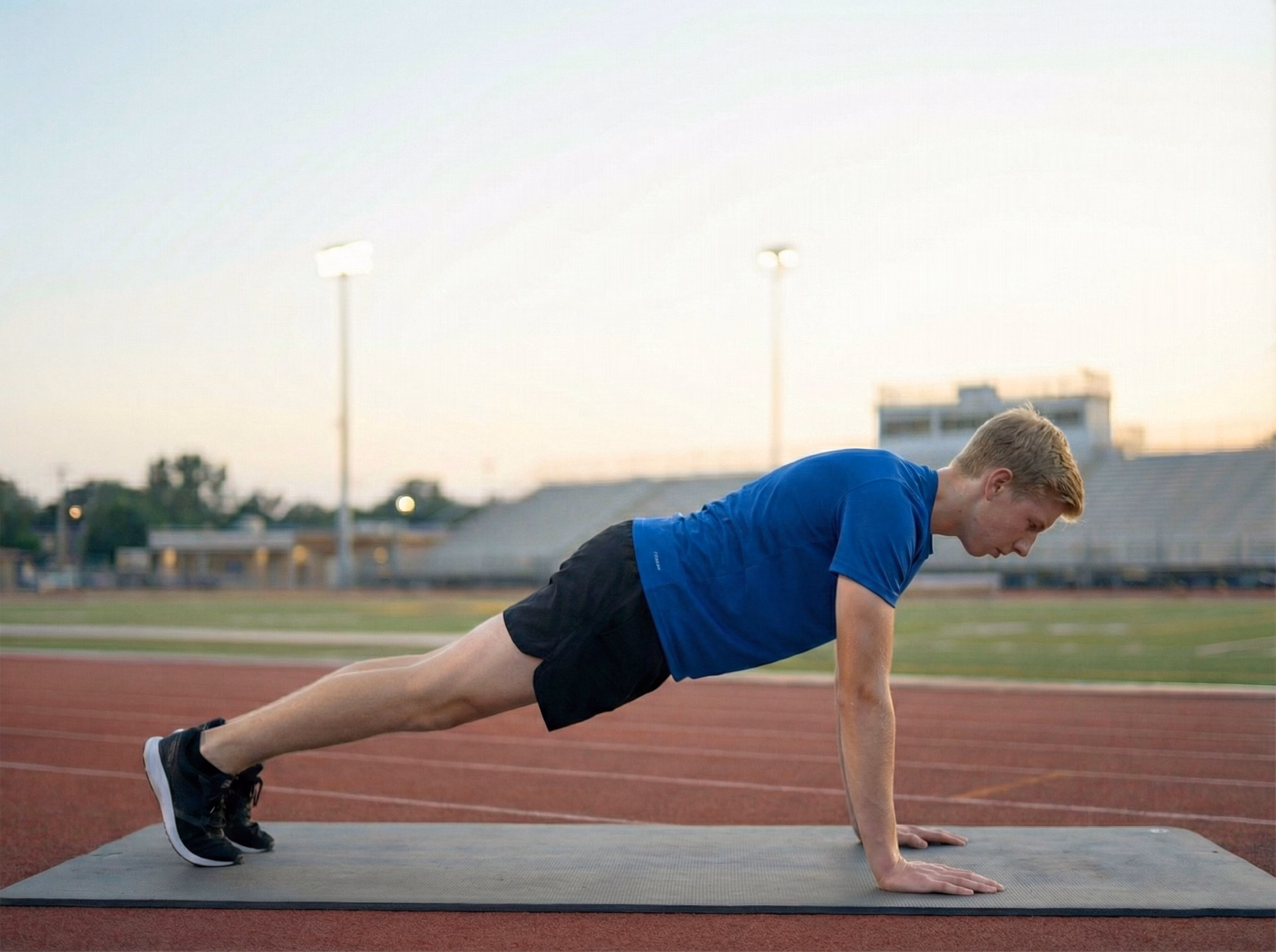 Mistake – Teen in a burpee with sagging hips and weak plank position