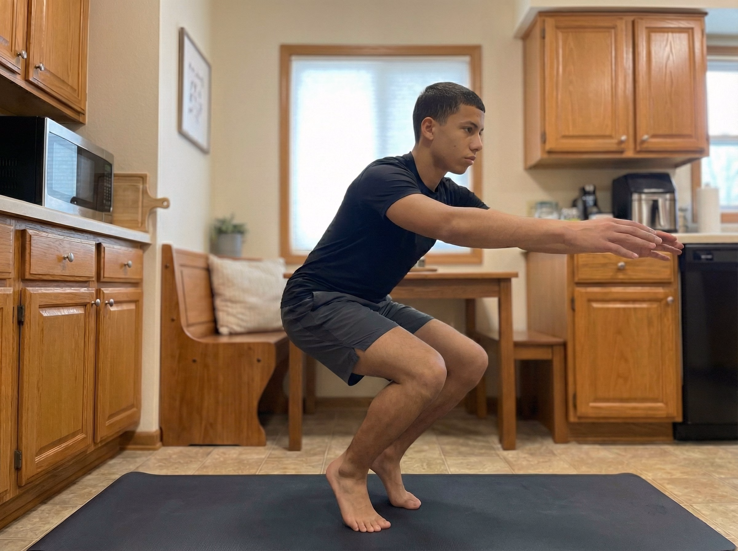 Mistake – Deep squat with heels up and knees collapsed inward