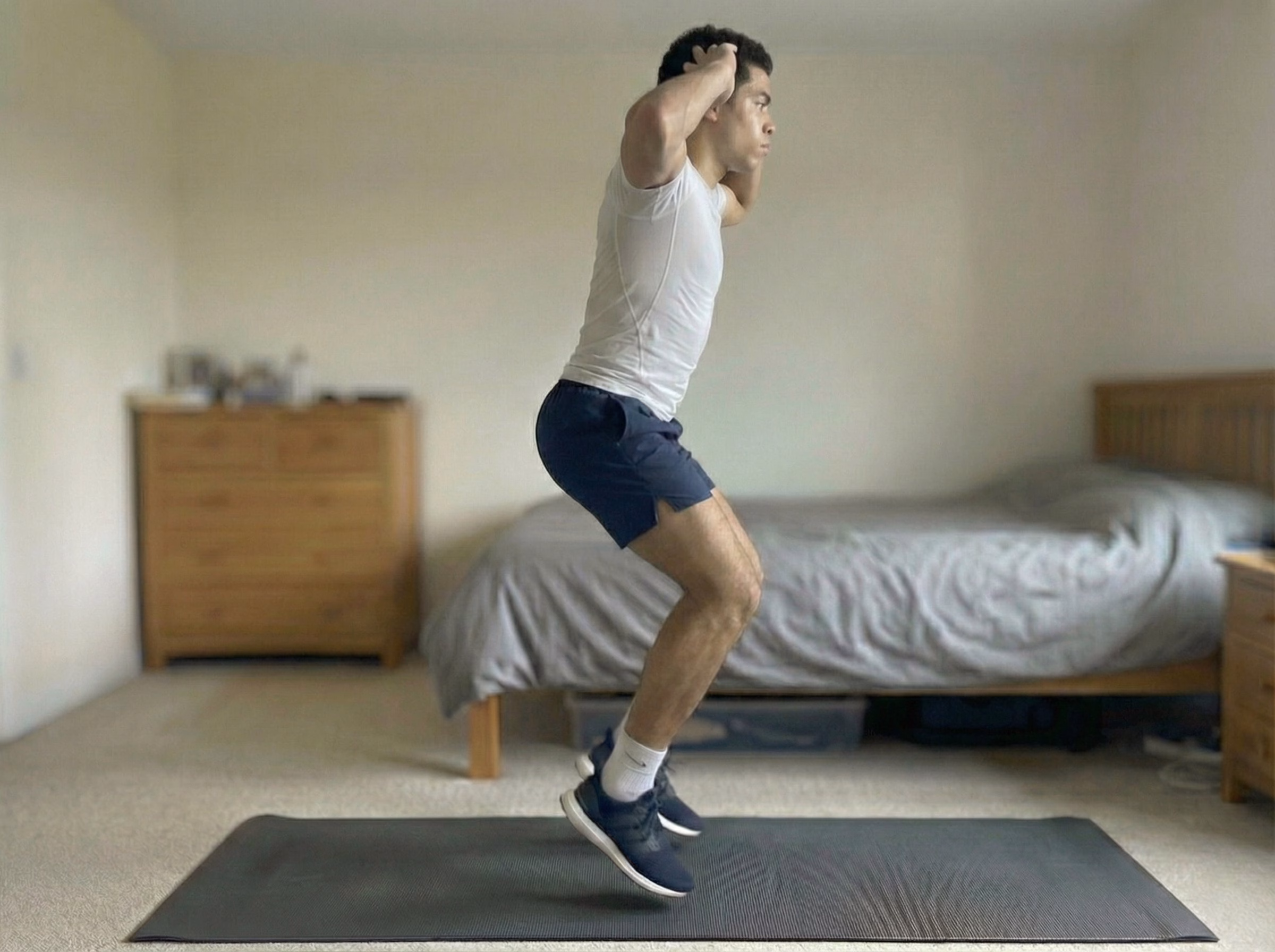 Arms-overhead jump squats for taller posture