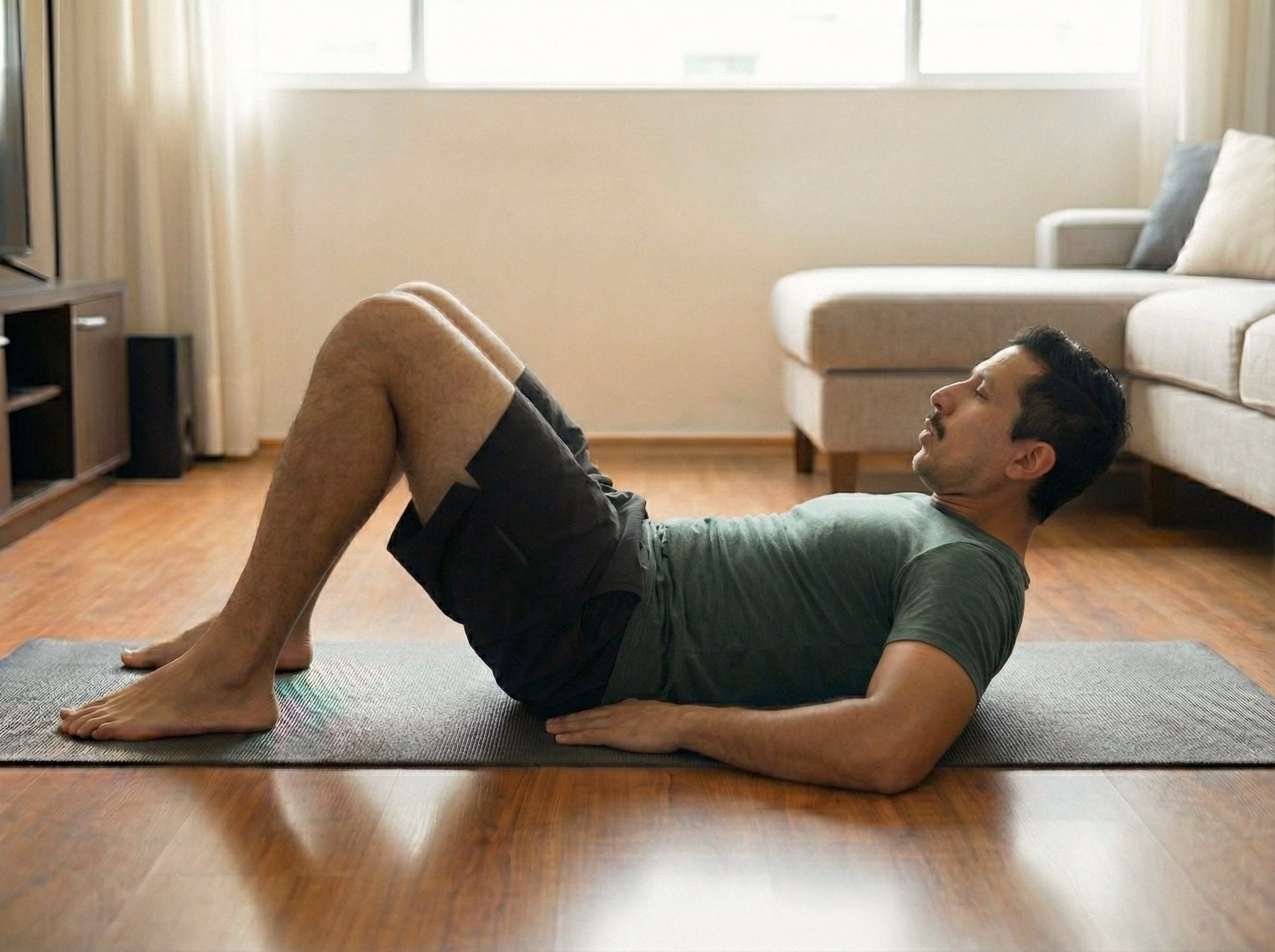 Latino man performing breath-focused curl-up