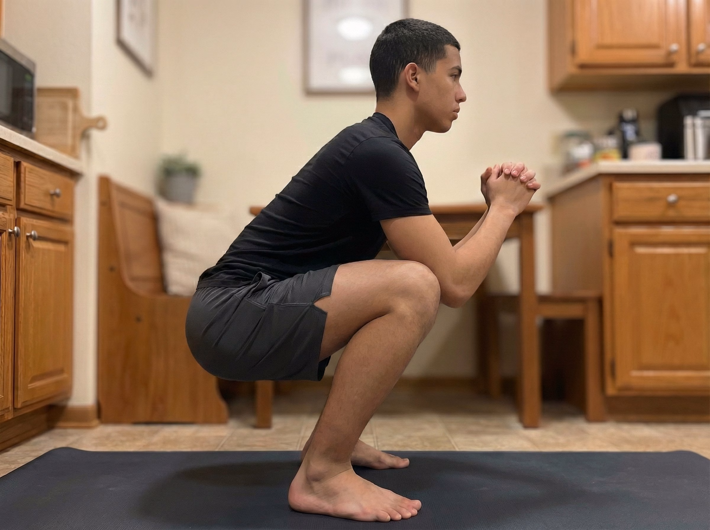 Step 2 – Deep squat hold with heels down and open chest