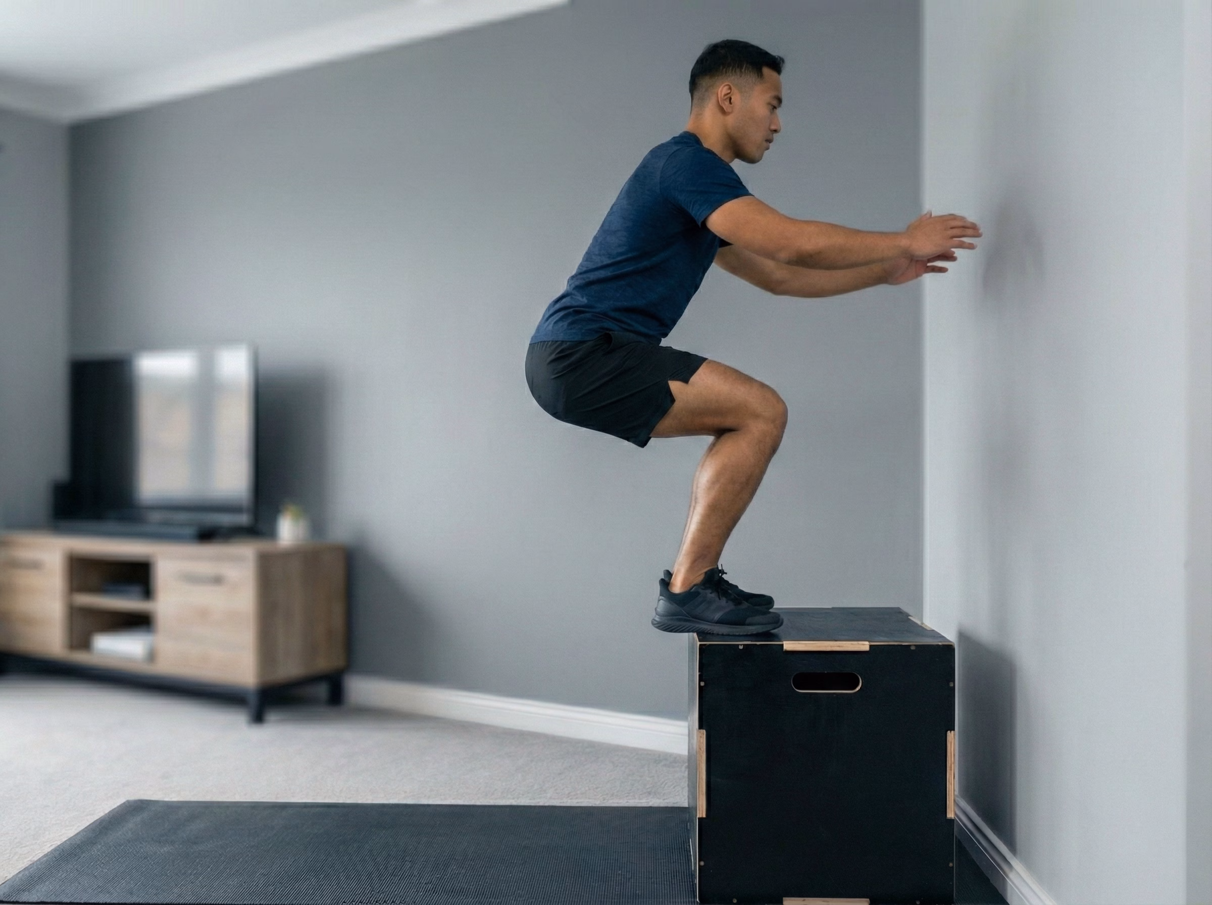 Step 3 – Teen landing softly on the box with a blue glow through legs and spine