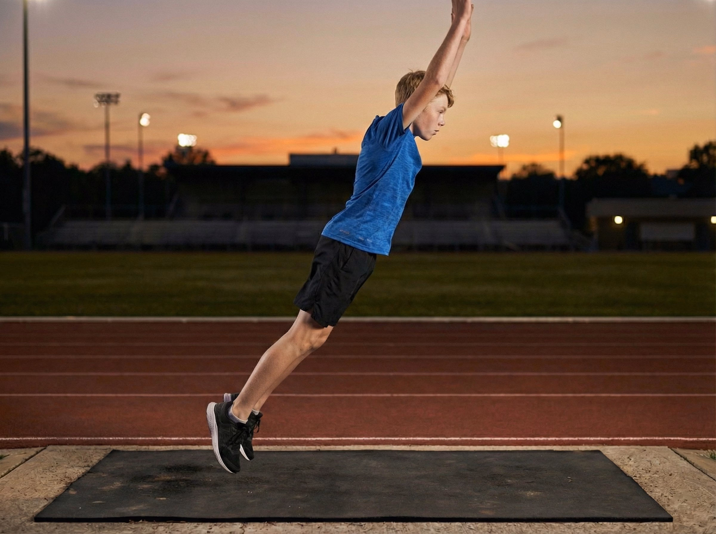 Step 3 – Teen jumping tall with arms overhead at the end of a burpee