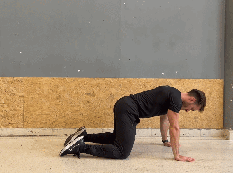 Person demonstrating the Child's Pose spine stretch