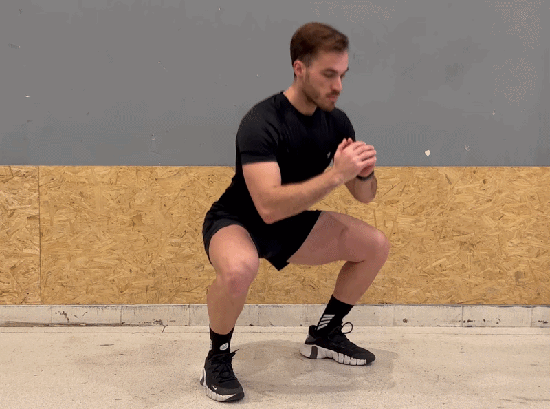Hero image – Deep squat hold with relaxed hips, heels down and blue height glow