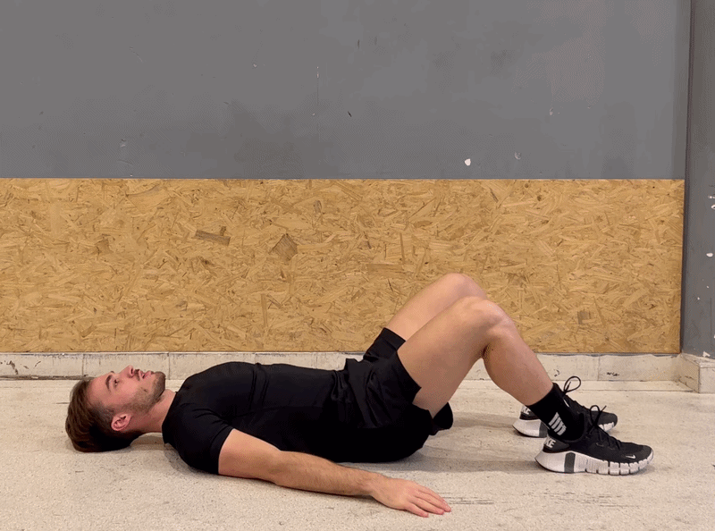 Person demonstrating the glute bridge exercise for spinal alignment