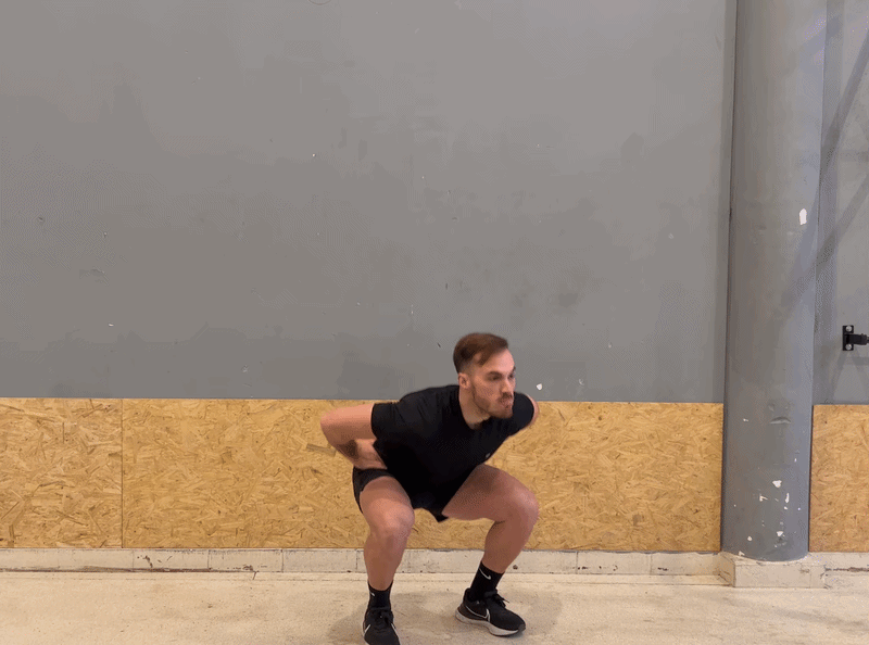 Hero – Teen athlete in mid-air jump squat with a soft blue vertical glow