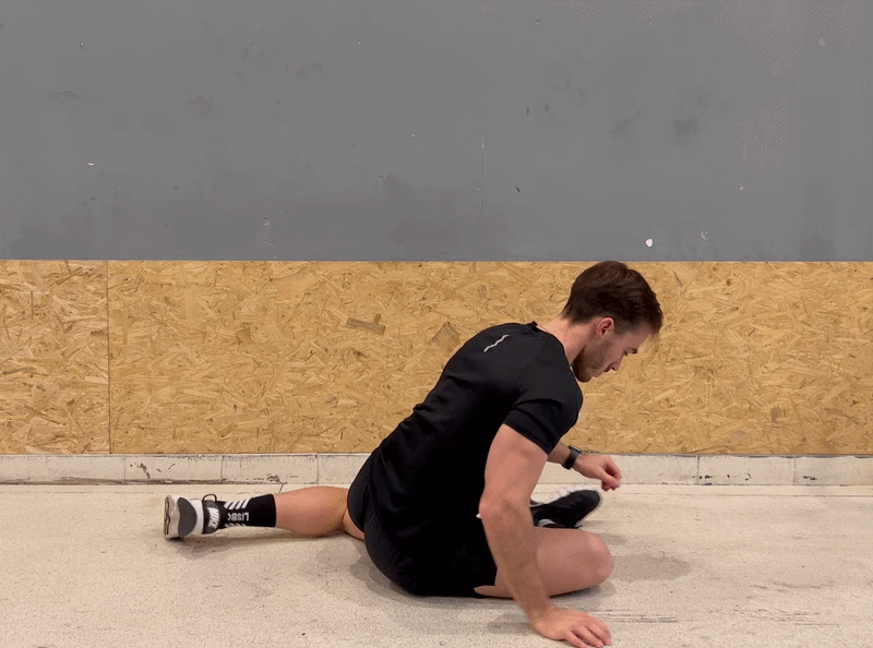 Person demonstrating the pigeon pose stretch