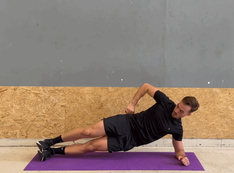 Hero image – Man #01 in full Side Plank with blue glow on side waist