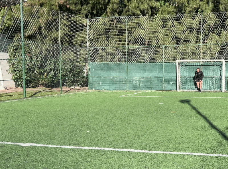 Hero – Teen sprinting all-out on a track with a soft blue height line from foot to head