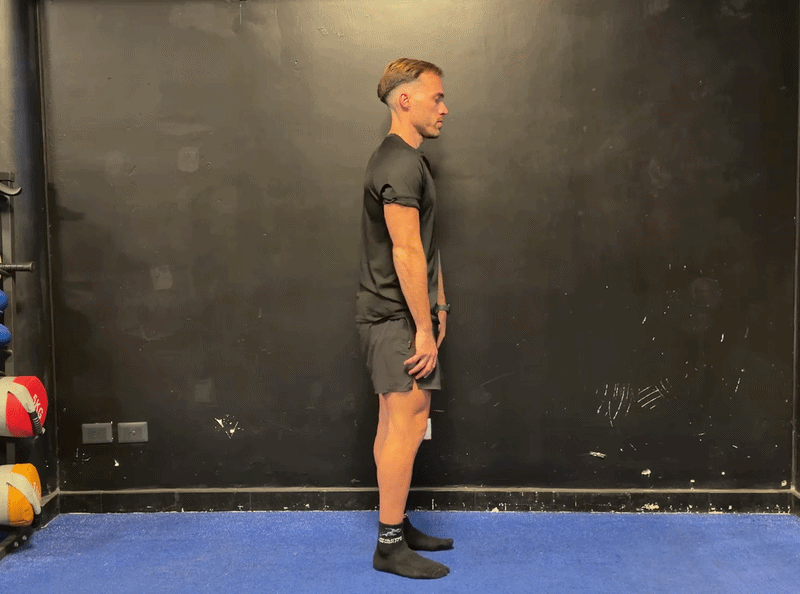 Person performing Tadasana mountain pose